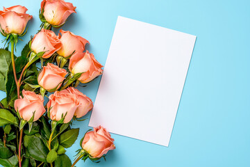 Roses blue background. Festive holiday greeting card for Birthday, Woman or Mothers Day, blank copy paper and a greeting card. View from above.