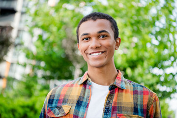 Sticker - Photo of nice young man beaming smile good mood wear shirt free time walk downtown street outdoors