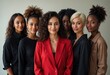 © Creative Clicks - A group of diverse women in red suits and black shirts pose for a photo