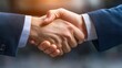 © supansa - Two professionals exchanging firm handshakes after negotiating a partnership deal, partnership agreement, successful outcome,