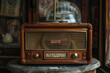© Formoney - An old radio with a wooden frame sits on a table