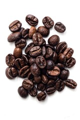 Wall Mural - A pile of coffee beans on a white surface