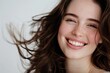 © Наталья Добровольска - : Portrait of a woman with dark brown hair on a white background, showcasing hairstyle.