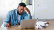 © Prostock-studio - Creativity crisis. Stressed employee sitting at workplace and looking to laptop screen, unable to finish work or financial report till deadline