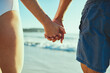 © StarDweller/peopleimages.com - Beach, holding hands and back of couple, nature and romance in holiday, water and bonding on date. Outdoor, travel and people at sea, fresh air and vacation in summer, waves and together with love