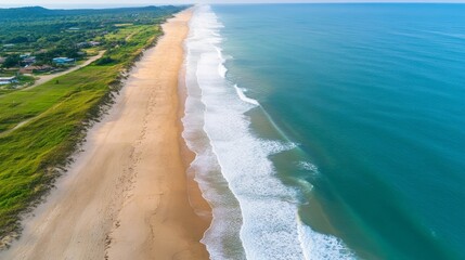 Serene Aerial View of Tranquil Beach and Ocean Waves