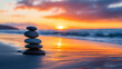 © Sawyer0 - Na tle pięknego zachodu słońca, na plaży, z równowagą ustawiony stos kamieni zen symbolizuje harmonię i wewnętrzny spokój.