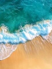 An aerial view of a turquoise ocean with gentle waves crashing onto a sandy beach. The scene symbolizes tranquility, relaxation, vacation, and summer.