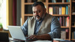 © Dirk - Plus size indian businessman in an office, working at laptop. Indian manager in his office, using a computer. modern office environment , business related banner. Heavy weight businessman body inclusi