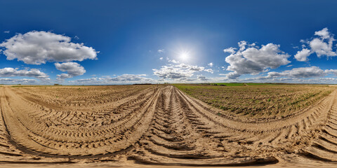 Wall Mural - 360 hdri panorama view on no traffic gravel dirt muddy road among fields in spring day with beautifu