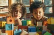 © Fotograf - Two kids constructing and having fun with building blocks, perfect for family, education, or advertising