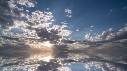 Wall Mural - movement of beautiful clouds across the sky with reflection in the lake, abstract, 4k, video, loop