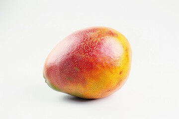 Wall Mural - A ripe mango sitting on a clean white surface, ready to be eaten or used in various creative projects