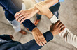 © TamJam/peopleimages.com - Above, hands and business people with huddle for collaboration, support and celebration for startup feedback. Teamwork, designers and target success with stack for solidarity, cooperation and office