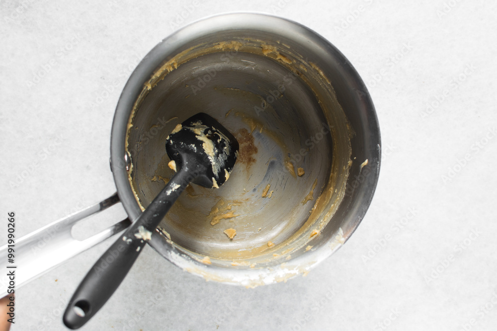 Overhead view of silver saucepan with fudge residue, top view of a ...