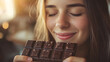 © AspctStyle - Joyful woman savoring a piece of chocolate, indulging in a sweet moment of bliss
