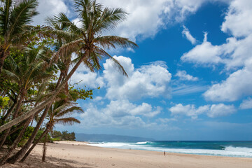 Scenic view of Banzai Beach on the island of Oahu, Hawaii, USA against blue sky with clouds