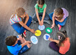 © Koegelenberg Coop/peopleimages.com - Children, group and playing a game on floor with communication icons, decision making and learning. Diversity, people and problem solving with educational activity, solution or knowledge on top view