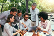 © JordaanExams/peopleimages.com - Pointing, meeting and business people in cafe with laptop for ideas, collaboration and workshop. Research, development and team at coffee shop for online planning, startup proposal or design project
