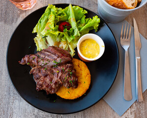 Fried beef with tomato, sauce and herbs, Onglet de bouef. French traditional dish