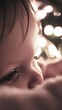 © OVAVOai - Close-Up of a Child in Soft Light with Christmas Lights