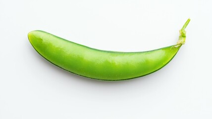 A green bean is shown in its natural state, with a stem protruding from the top