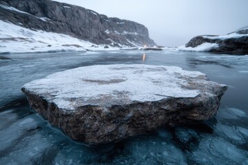 Canvas Print - Frozen lake with snowy cliffs in the background