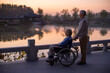 © Blue Jean Images - Senior Man Pushing Wife in Wheelchair