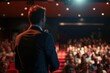 © Anasaiimages - Man in suit addressing large audience with microphone, suitable for presentations, public speaking, conferences, leadership, business. Generative AI