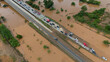 Aerial view of car stuck on the bridge after road flooded during typhoon Yagi has swept Chiang Rai province of Thailand.