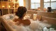 © Ah Pich  - A person soaking in a bubble bath with a book and a drink.