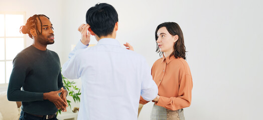 Poster - Multinational people standing and talking in an office
