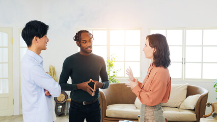 Poster - Multinational people standing and talking in an office