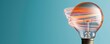 © ParinApril - A creative light bulb with swirling orange filaments against a teal background, symbolizing innovation and energy.
