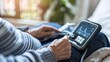© Vanessa - Close-up of an elderly person using a portable ECG device to monitor heart health at home. Medical, healthcare, senior care,technology, digital health,nursing home,electrocardiogram,health monitoring