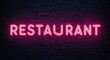 © Erlinda - restaurant word lettering glowing with neon light on dark brick wall background