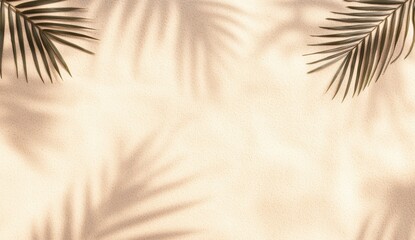 Tropical palm leaves casting shadows on beige sand background