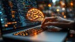 © Ta - A hand interacts with a glowing brain icon on a laptop screen, representing the impact of technology and digital innovation on modern thinking.