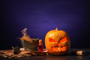 Poster - Halloween composition with jack-o-lantern, mortar, book spell and bottle of poison on table near black wall