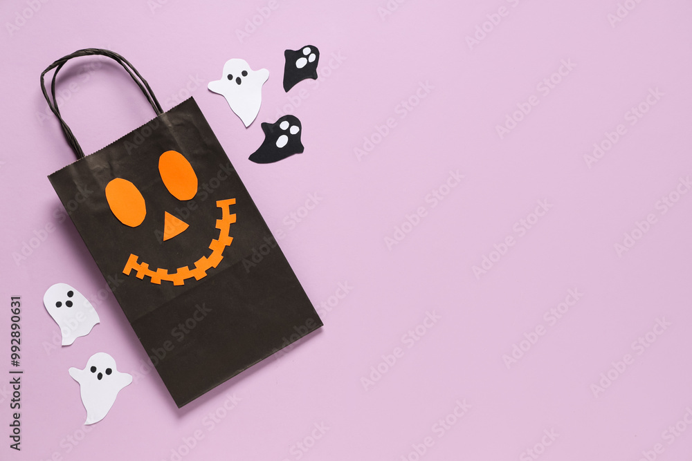 Composition with Halloween shopping bag and paper ghosts on pink background
