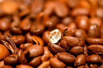 A pile of coffee beans spilled on the table