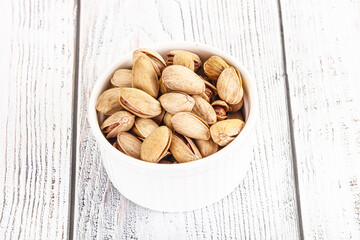 Poster - Salted tasty pistachio nuts heap