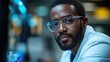 © Ta - An African American scientist in a modern lab, focusing on the research and development of microelectronics and processors.