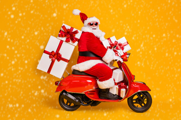 Wall Mural - Full size profile side photo of white grey hair bearded santa claus ride motorbike deliver x-mas christmas gifts on noel night wear headwear isolated bright shine color background