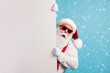 © deagreez - Portrait of his he nice attractive funky amazed astonished wondered white-haired Santa holding copy empty blank place space novelty isolated over bright vivid shine vibrant blue color background