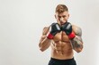 © Mykola - White Background Fitness. Caucasian Man Doing Cardio Boxing Exercises in Studio