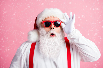 Sticker - X-mas christmas incredible magic discounts. Astonished santa claus impressed touch white gloves sunglass eyewear overalls wear style costume isolated over pastel color background