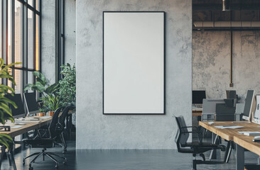 Wall Mural - A white, vertical, blank poster frame on a wall in a modern office with desks and computers