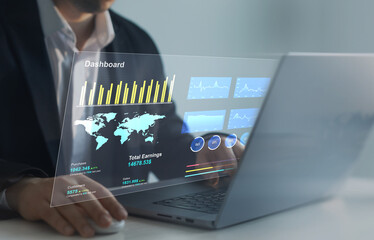 Leinwandbilder - Businessman using computer dashboard analyzing sales data and financial report. Financial Management data System KPI connected in database for follow earnings,operations and sales data.