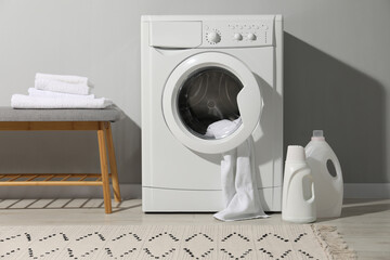 Poster - Washing machine, towels and detergents in laundry room